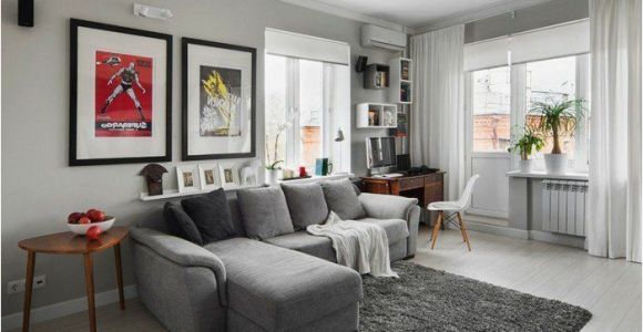 Wohnzimmer Graues sofa Welche Wandfarbe Ein Graues sofa Grauer Teppich Bunte Bilder Weiße Gardine